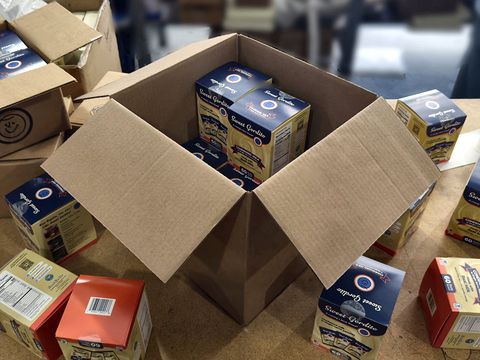 Open cartons of a partner brand's product, unpacked on arrival at our warehouse